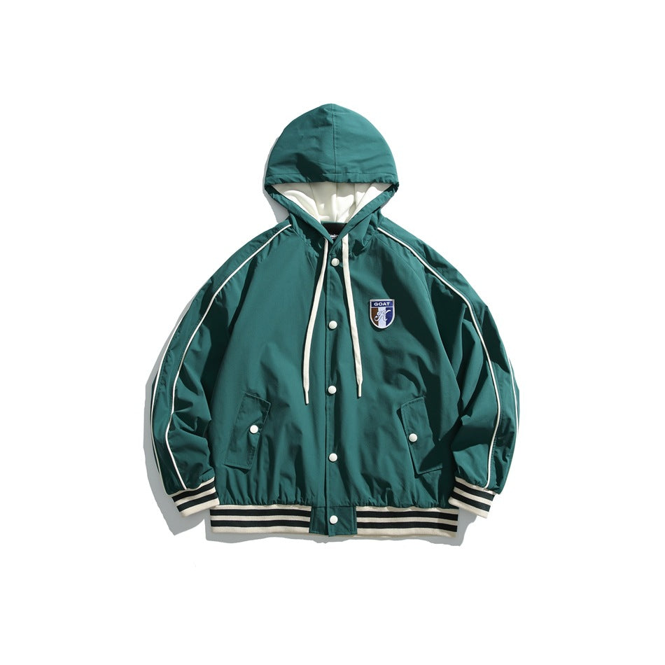Dark green hooded snap-front jacket with cream piping, striped trim and chest shield patch, flat lay