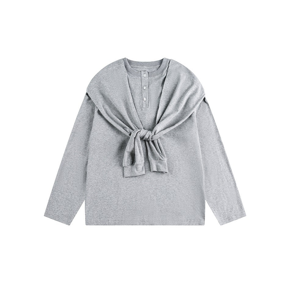 Light gray long-sleeve henley top with a three-button placket and matching sweatshirt tied across the chest.