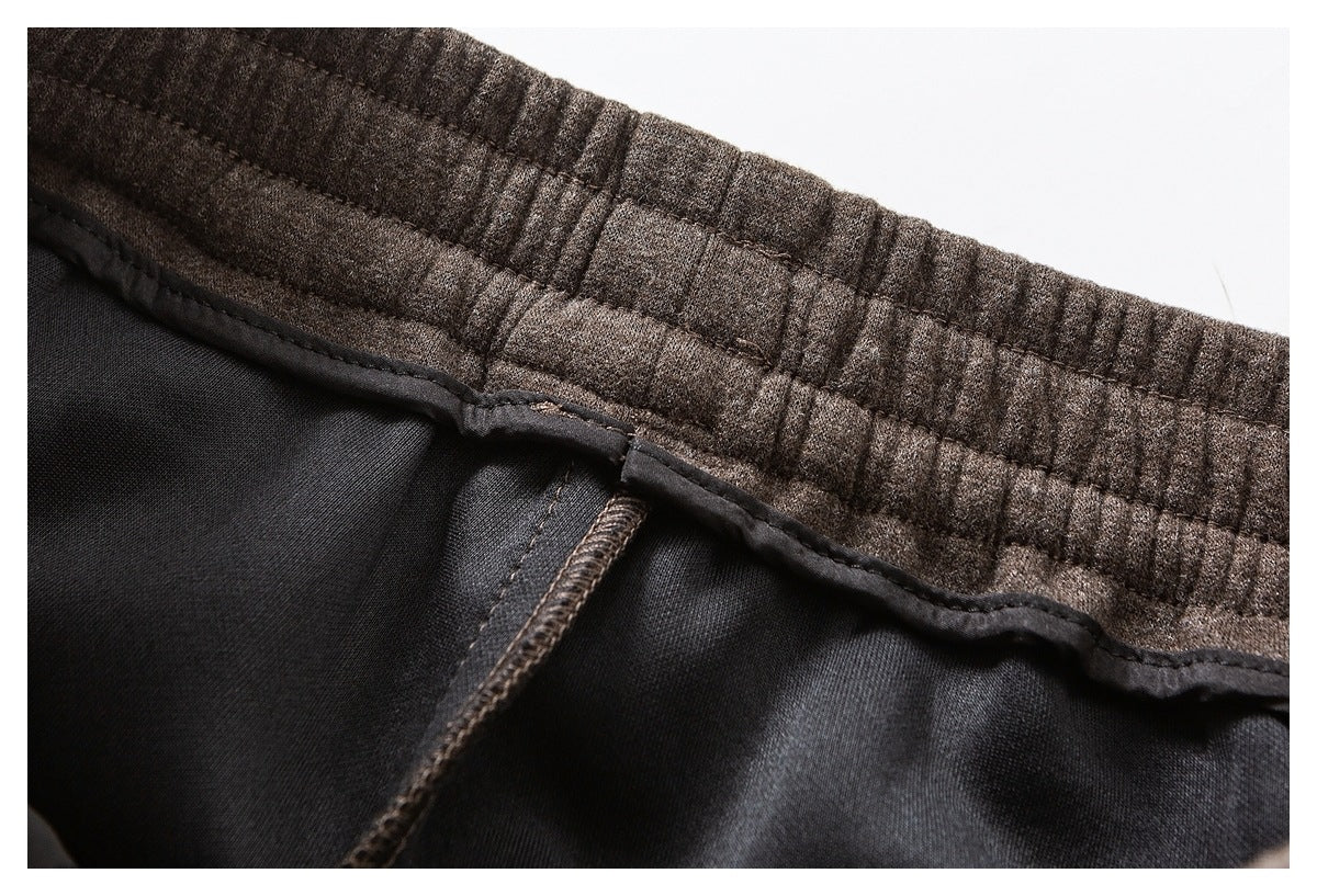 Close-up of a dark brown elastic waistband and black interior lining.