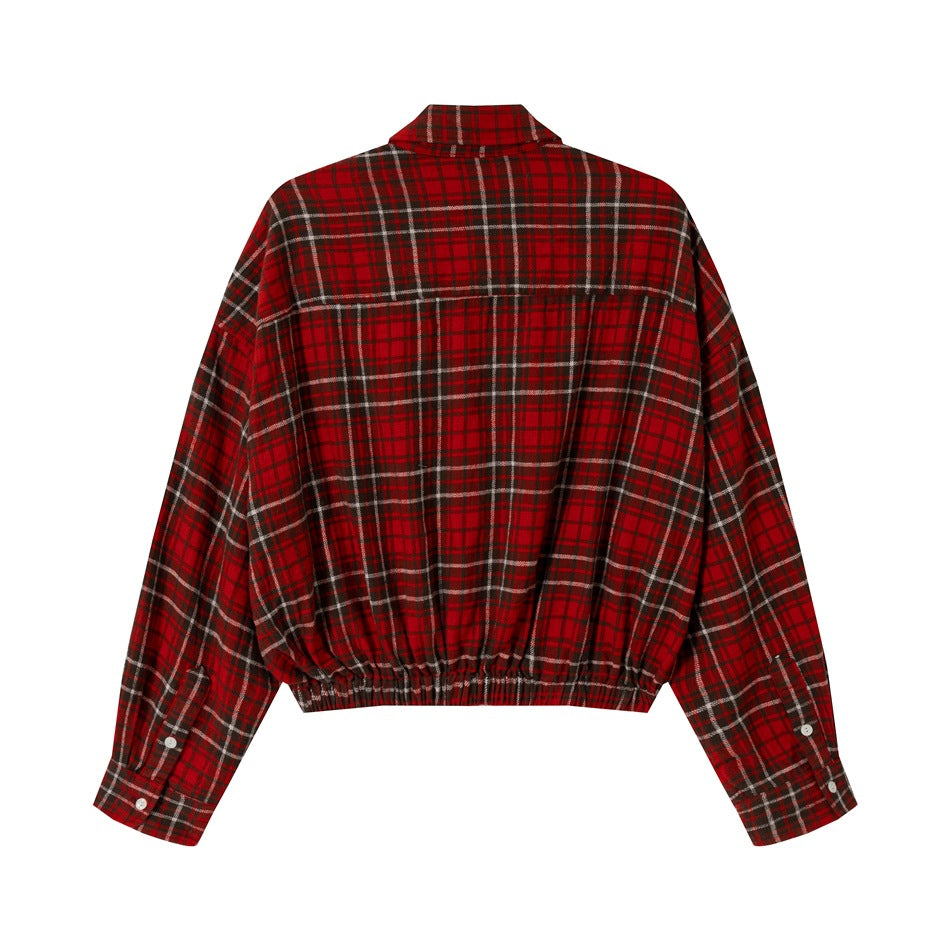 Back view of a red, black, and white plaid shirt with long sleeves and an elasticated hem.