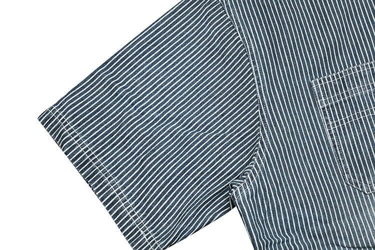 Close-up of the short sleeve and side of a dark blue pinstriped shirt.