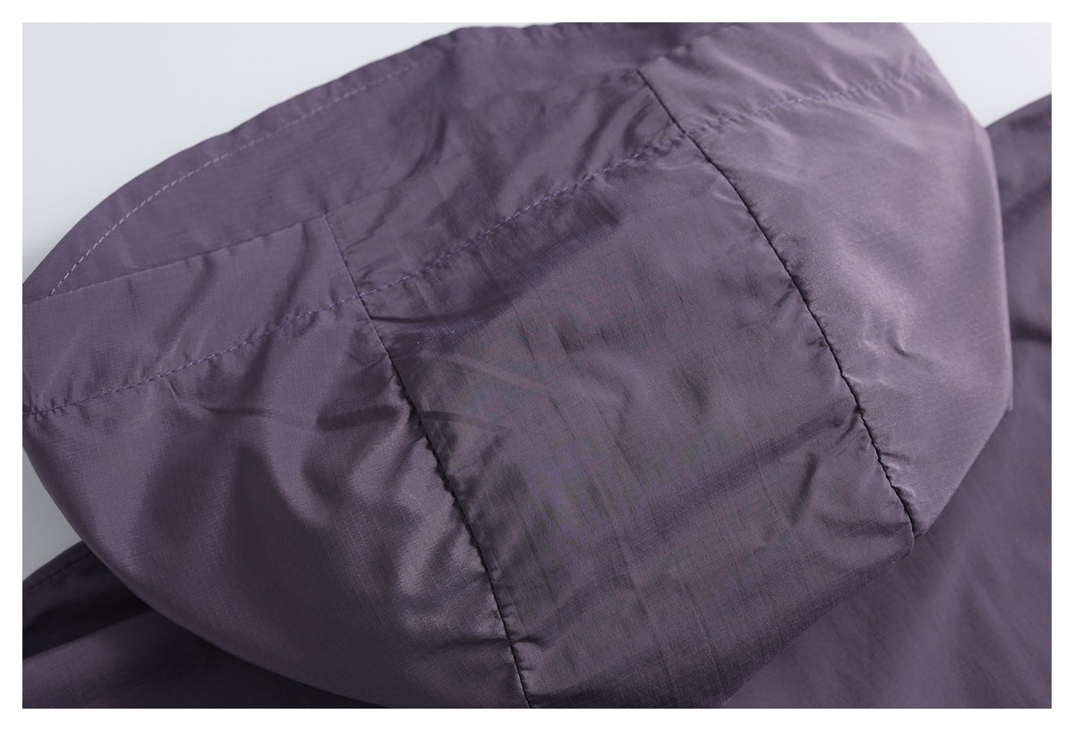 Close-up of the stitched hood panels on a dark purple jacket.