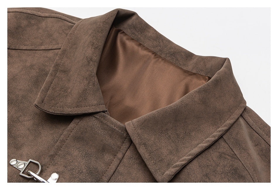 Close-up of the brown jacket's pointed collar, inner lining, stitching, and metal clasp.