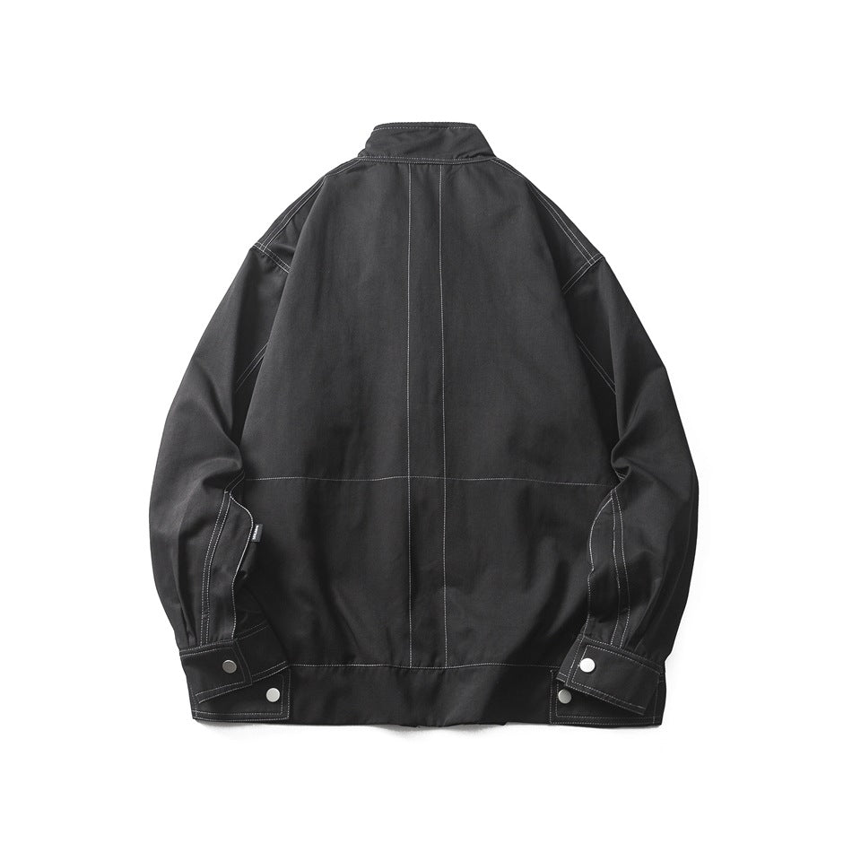 Back view of a black jacket with a stand collar, contrast stitching and snap-button cuffs.