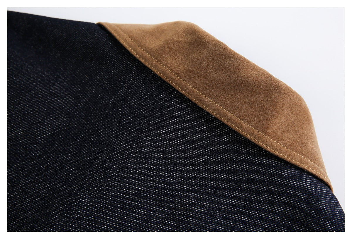 Dark indigo denim with a curved tan-brown panel and visible topstitching.