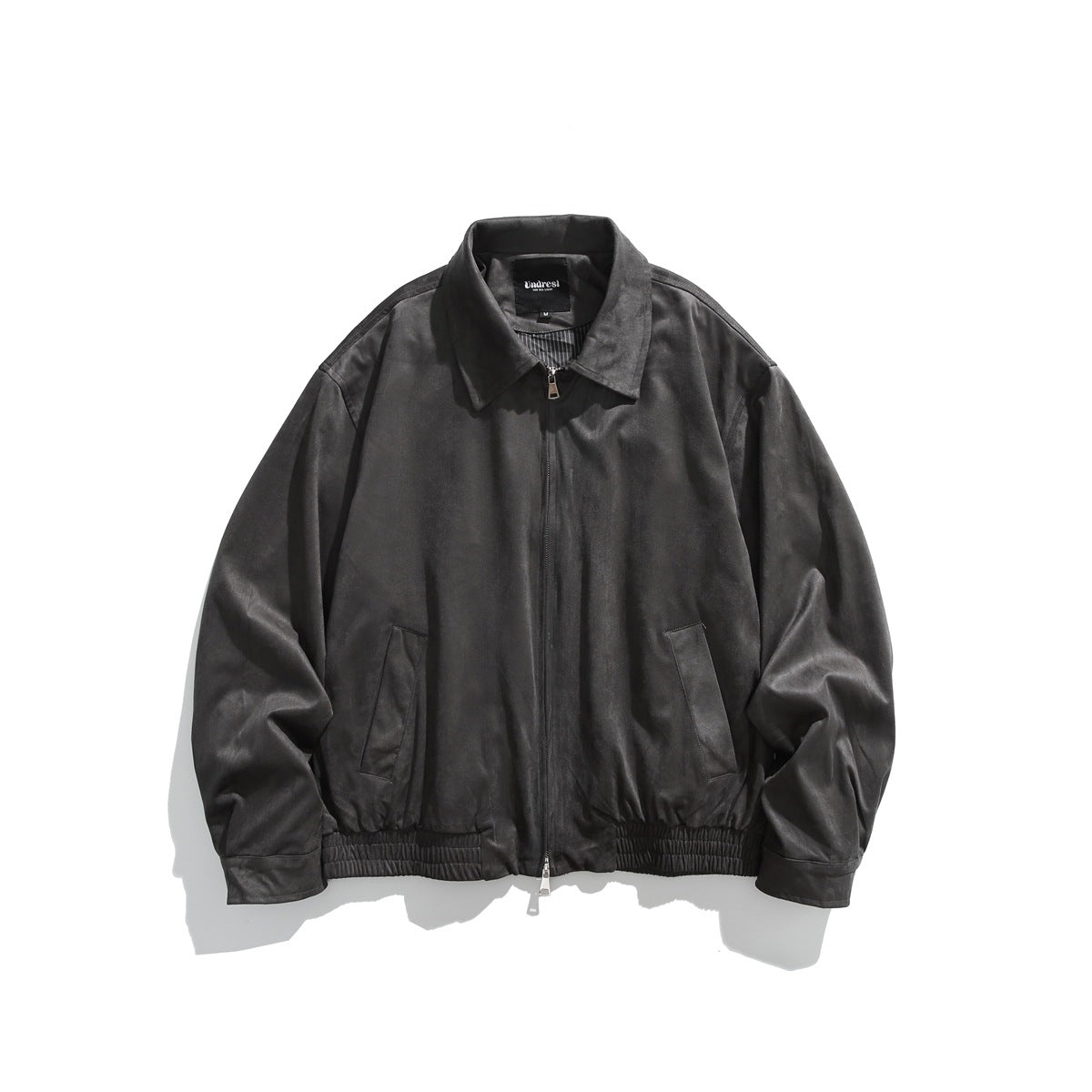 Gray suede-like collared zip-front jacket laid flat, front view with slanted pockets and elastic hem