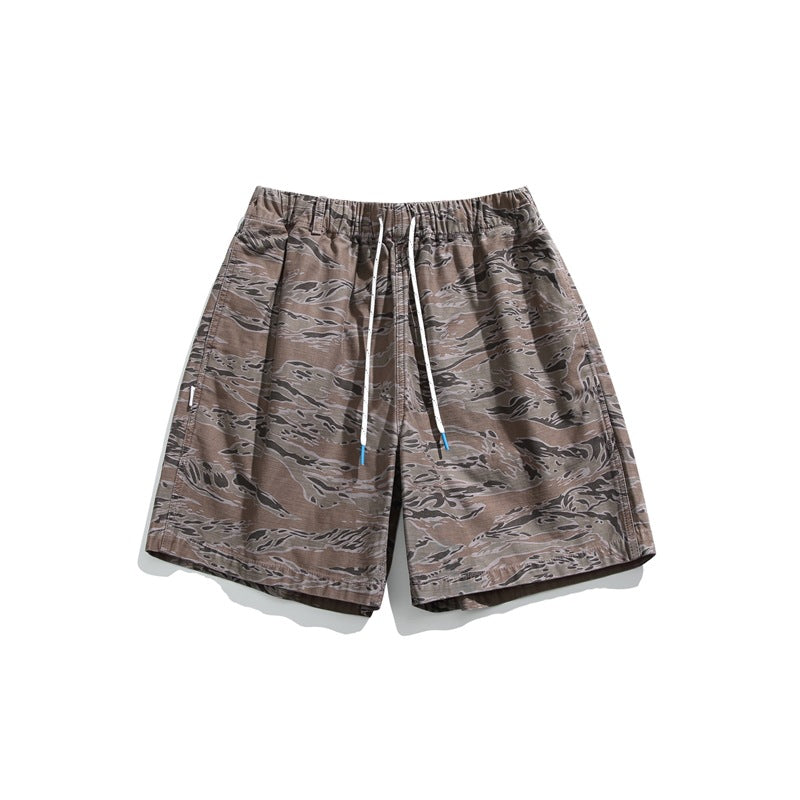 Tiger stripe camo khaki shorts with white drawstring and elastic waist, flat lay front view
