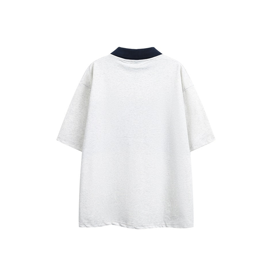 Back view of light heather gray short-sleeve top with navy collar, plain back