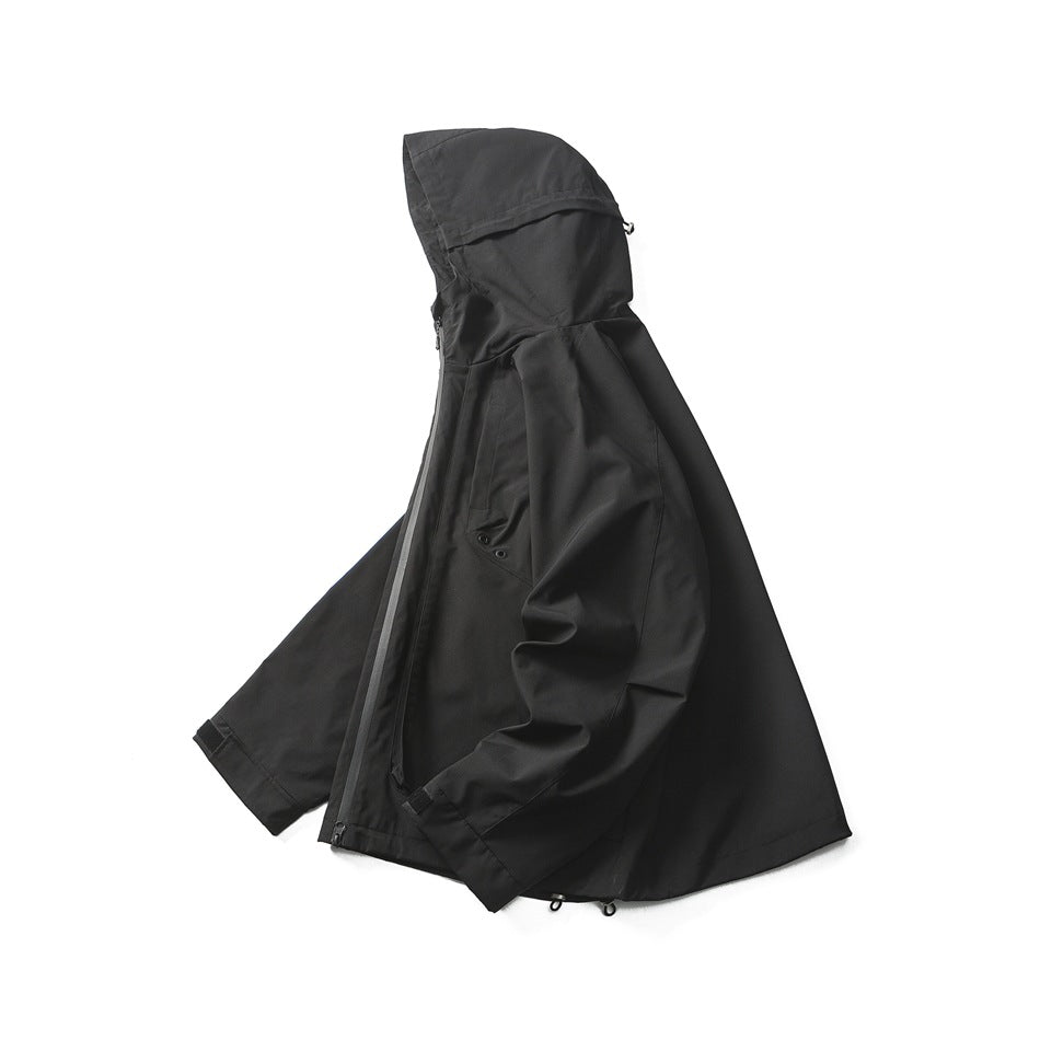 Side profile of a black hooded jacket, showing its zipper, pocket, sleeves, and hem.