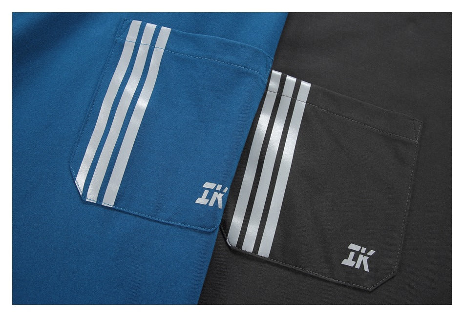Close-up of blue and charcoal garment pockets, each with three silver stripes and a small white emblem.