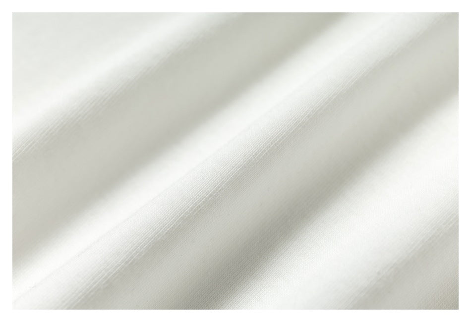 Close-up showing the fine surface texture of white fabric.