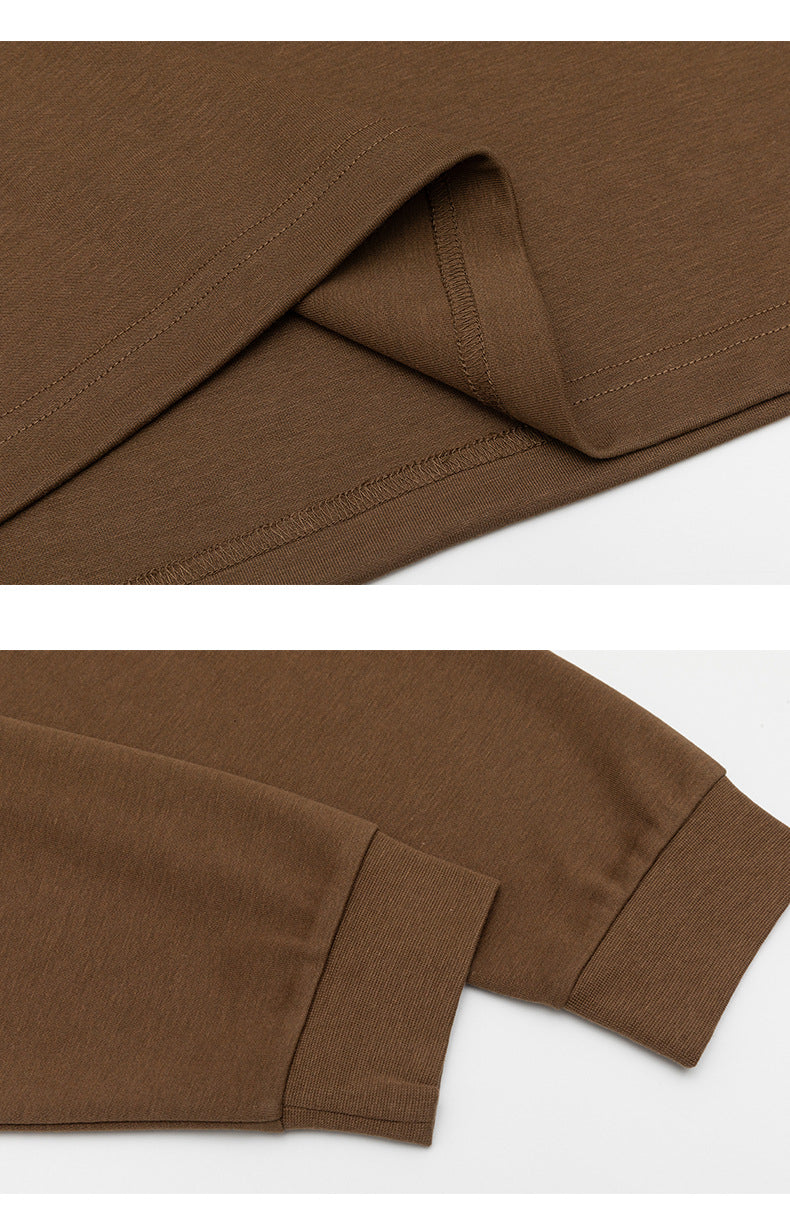 Close-ups show the brown shirt's stitched hem and ribbed sleeve cuff.