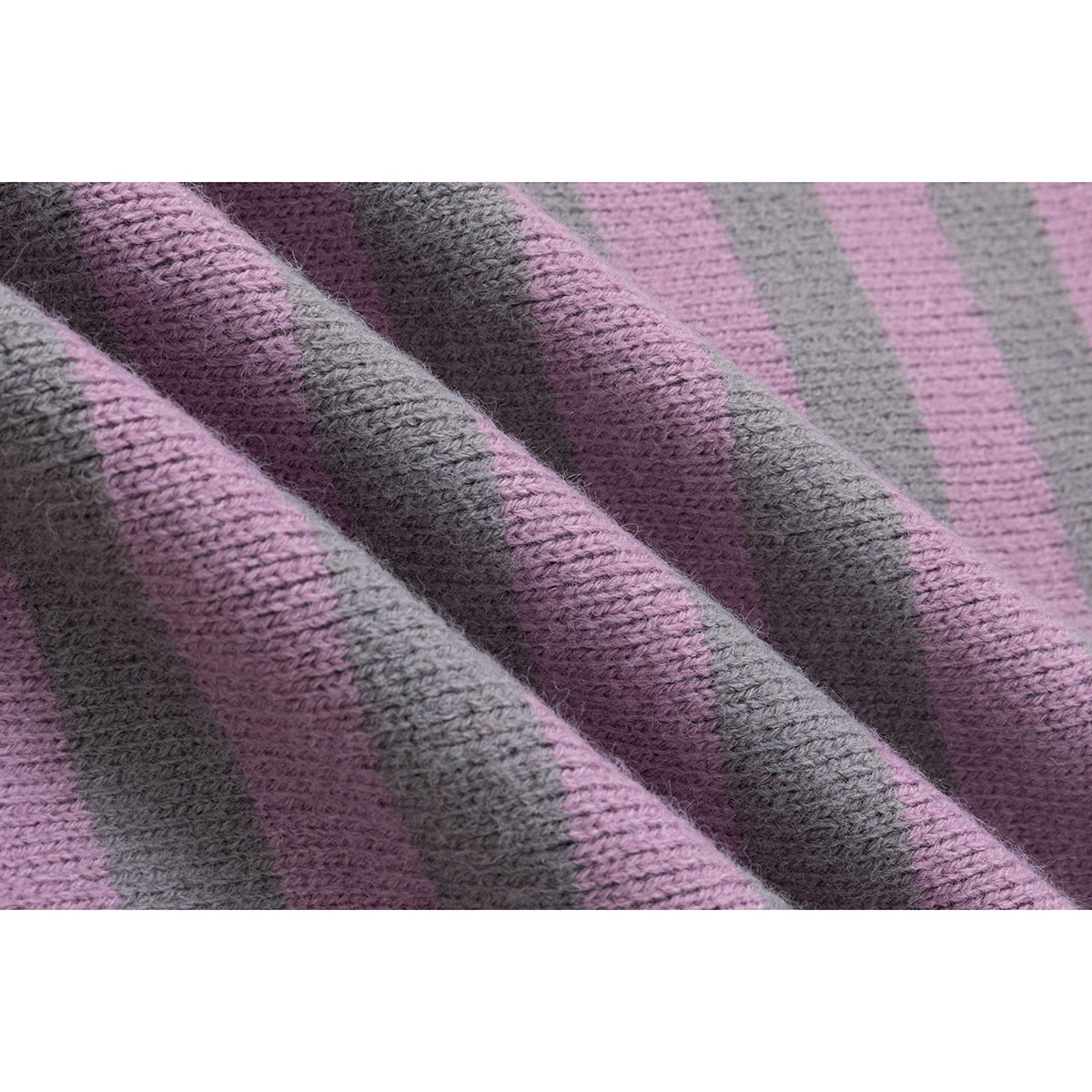 Close-up of the cardigan's mauve and gray striped knit texture.