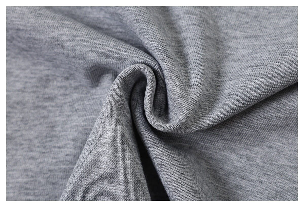 Close-up of heather gray knit fabric gathered into a spiral fold.