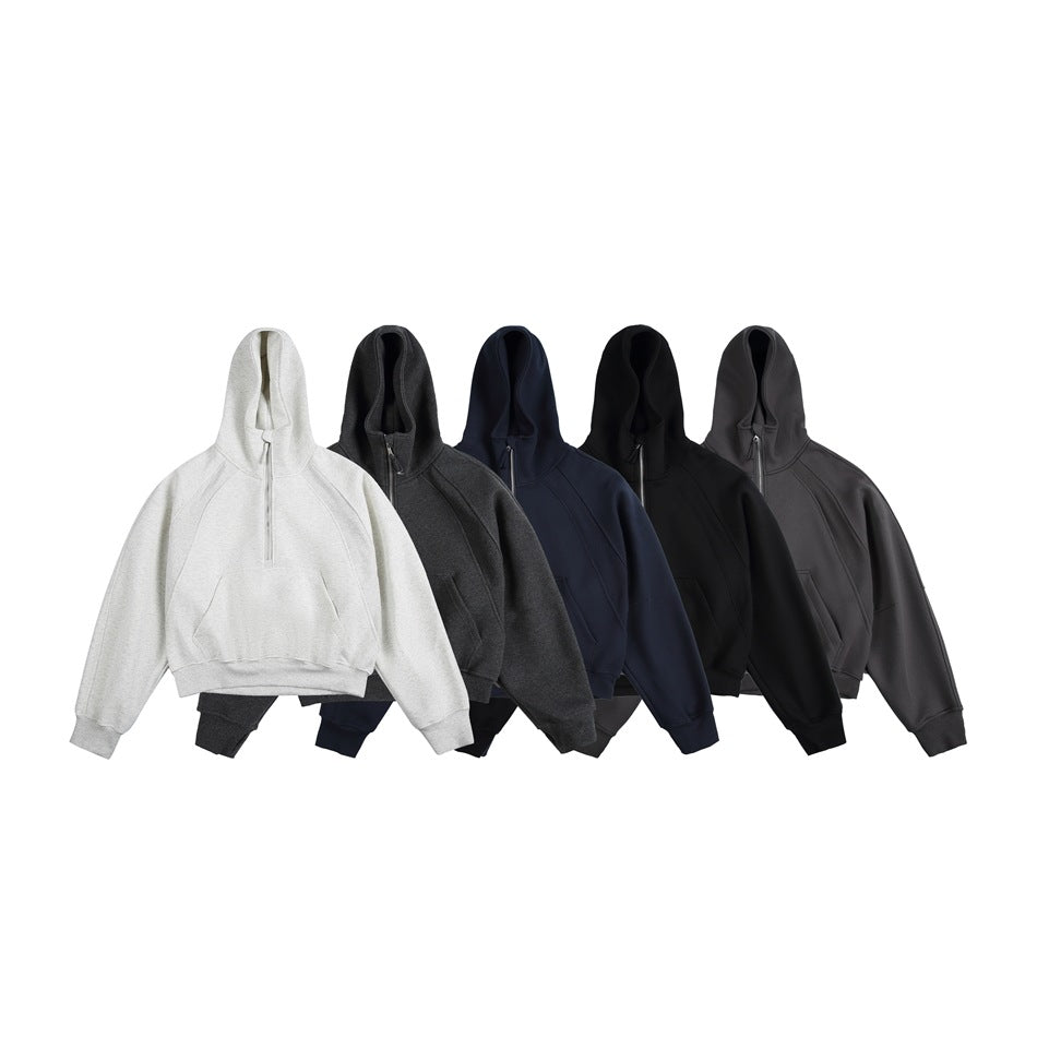 Five hoodies shown together in light gray, charcoal, navy, black, and dark gray, with hoods and short front zippers.