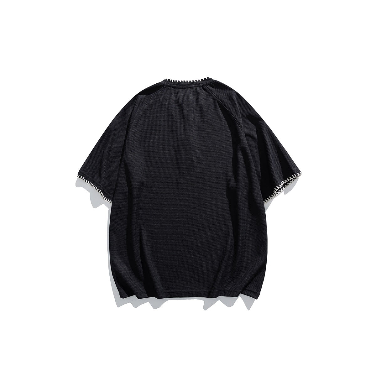 Back view of a black short-sleeve shirt with light contrast stitching around the collar and sleeve hems.