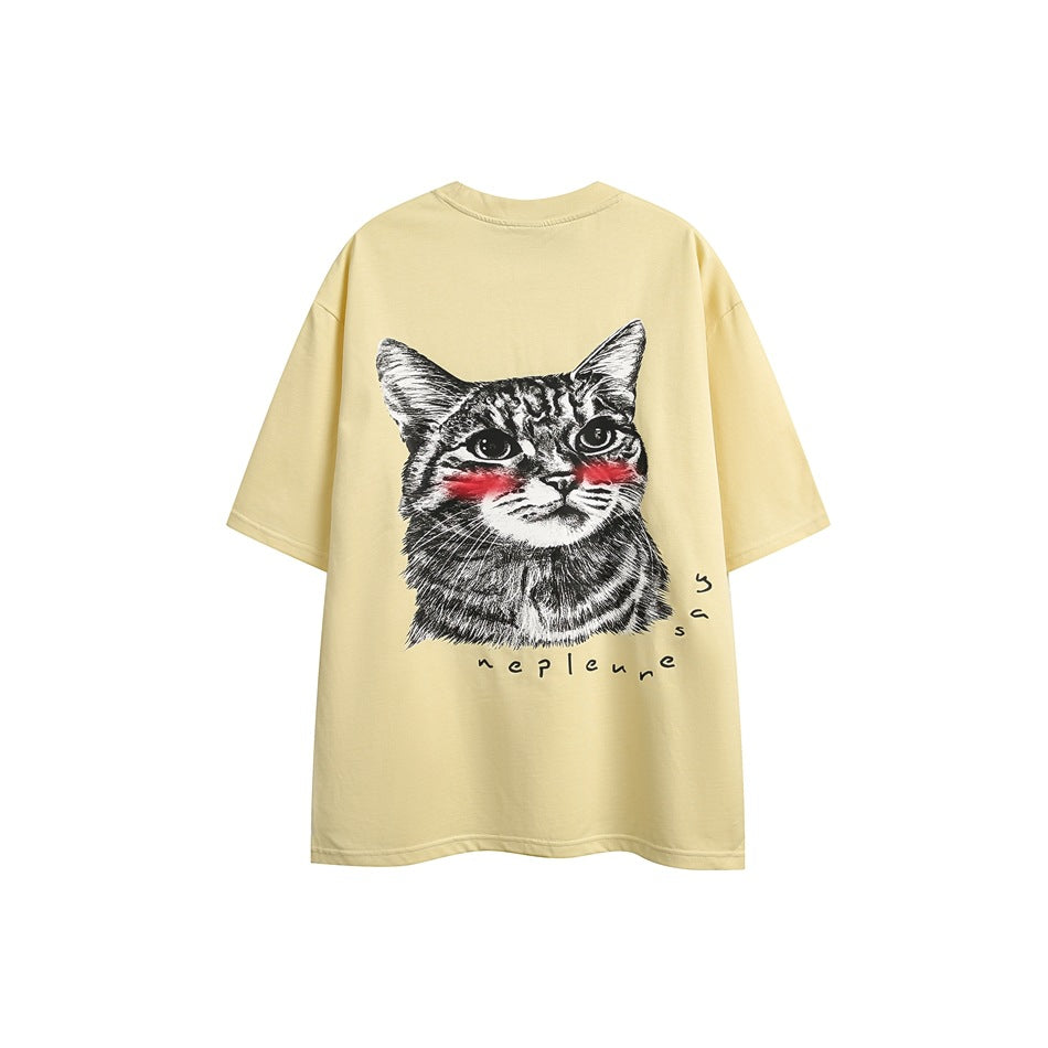 Light yellow short-sleeve crew-neck T-shirt, back view with a cat face graphic and red cheek accents