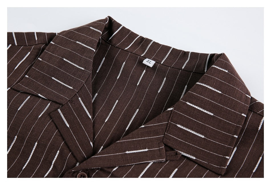Close-up of a dark brown striped garment showing its collar, lapels, and an XL neck tag.