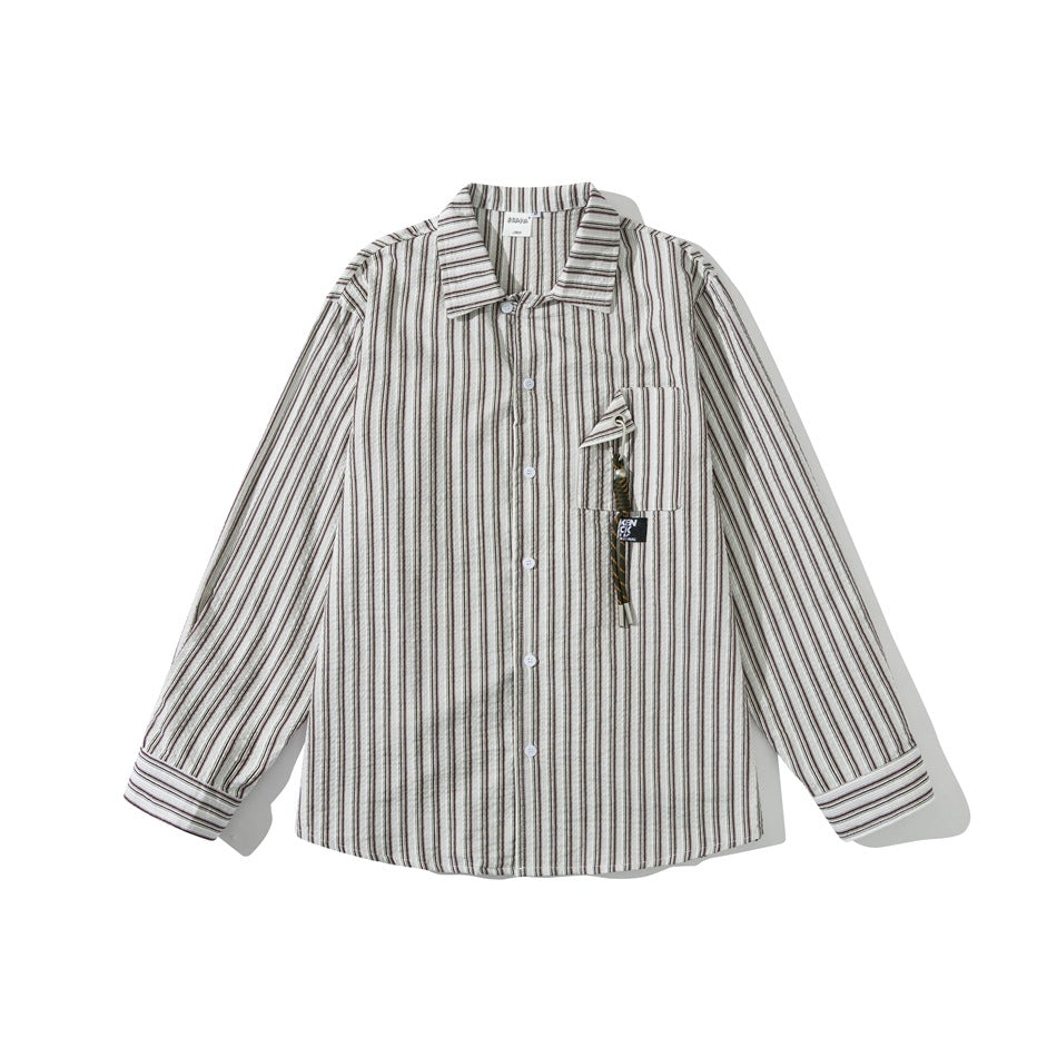 Khaki striped long-sleeve button-up shirt laid flat, front view with chest pocket and corded charm