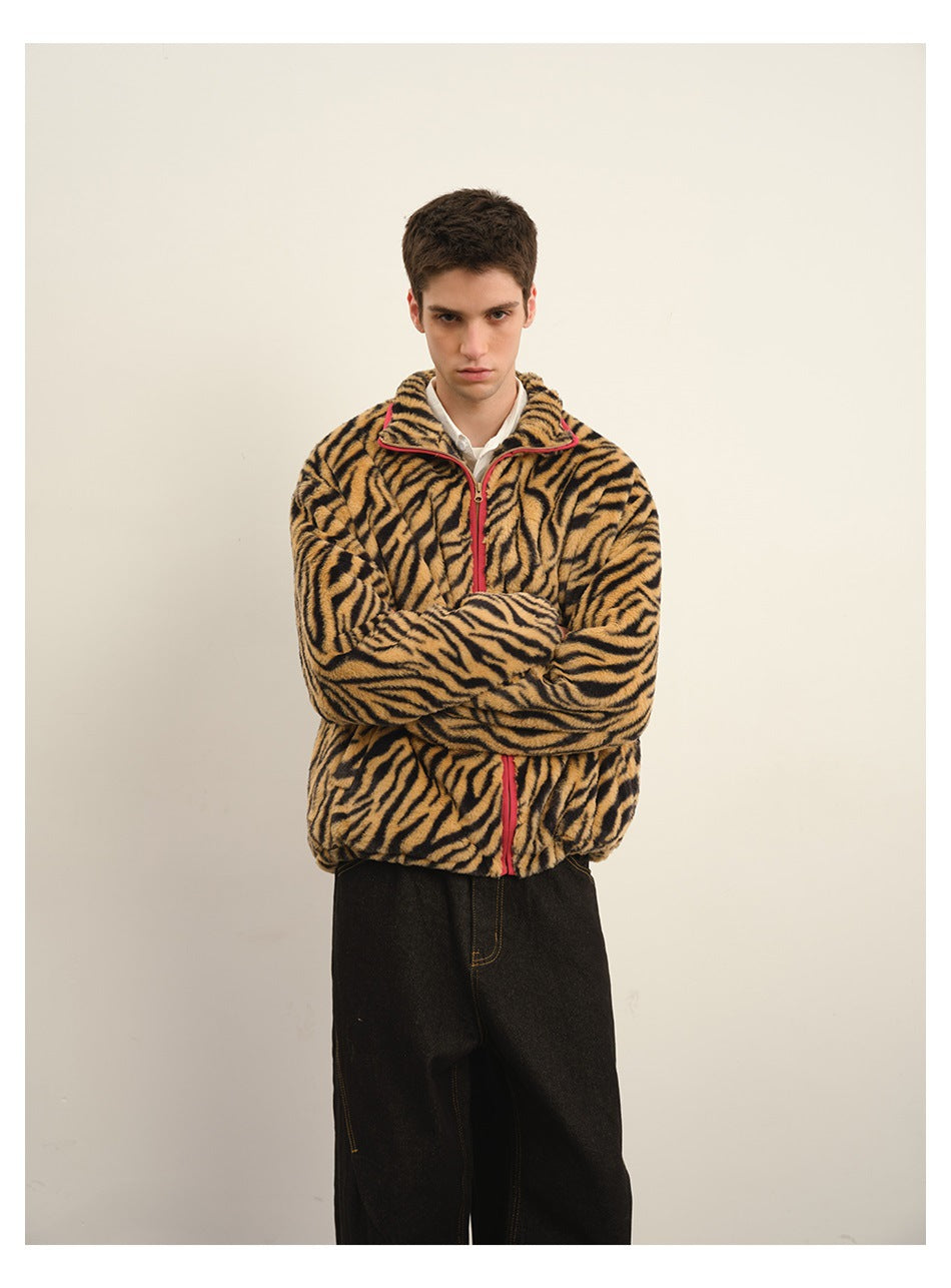 Front view of a model wearing a tan-and-black tiger-stripe fleece jacket with red zipper and trim.