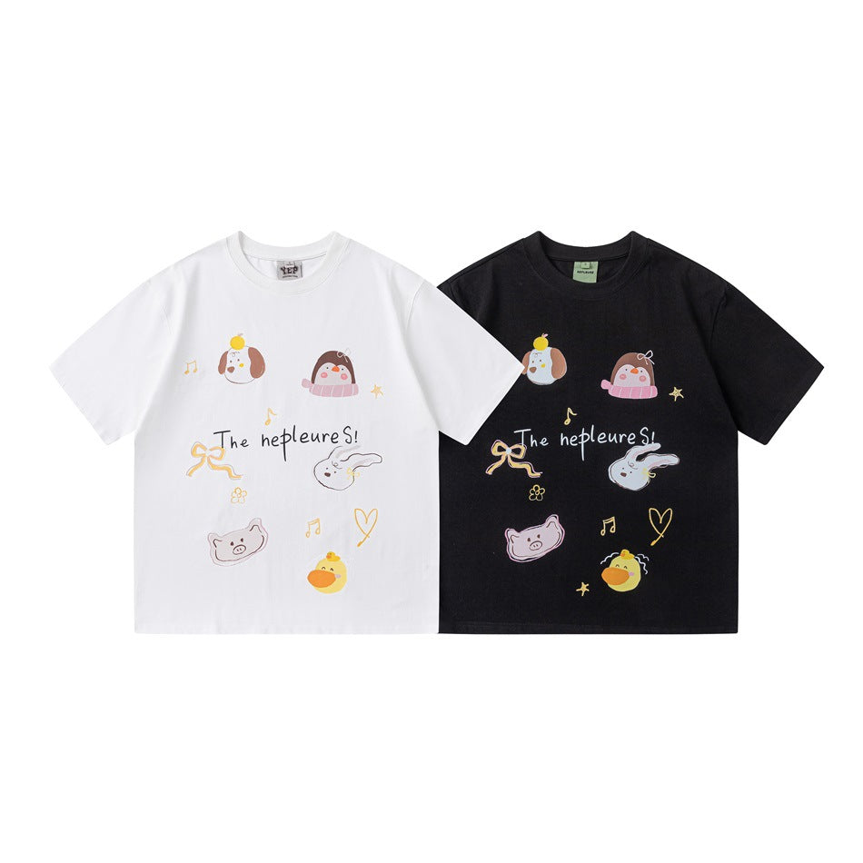 White and black short-sleeve T-shirts shown from the front, both with colorful playful animal graphics and lettering.