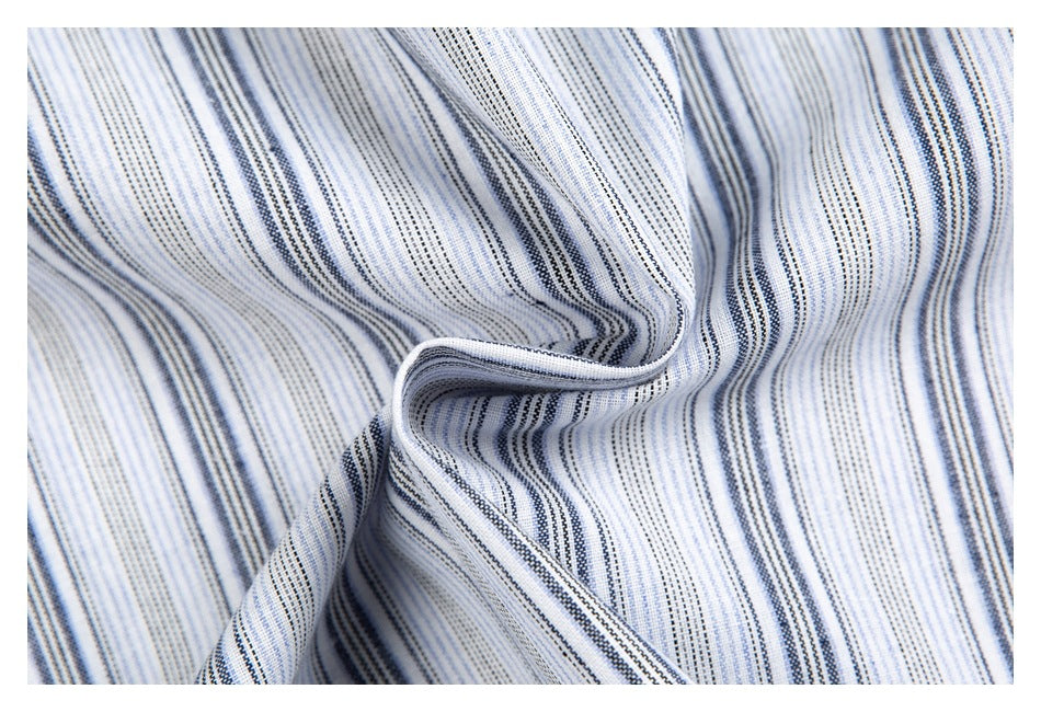 Close-up of draped fabric with narrow gray and blue vertical stripes.