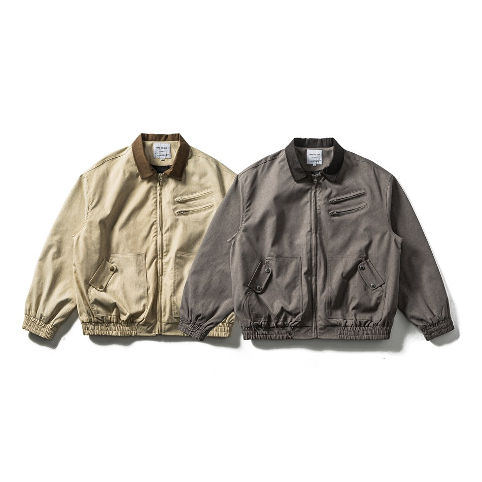 Front view of two collared zip jackets, one light beige and one charcoal gray, with flap pockets and elastic hems.