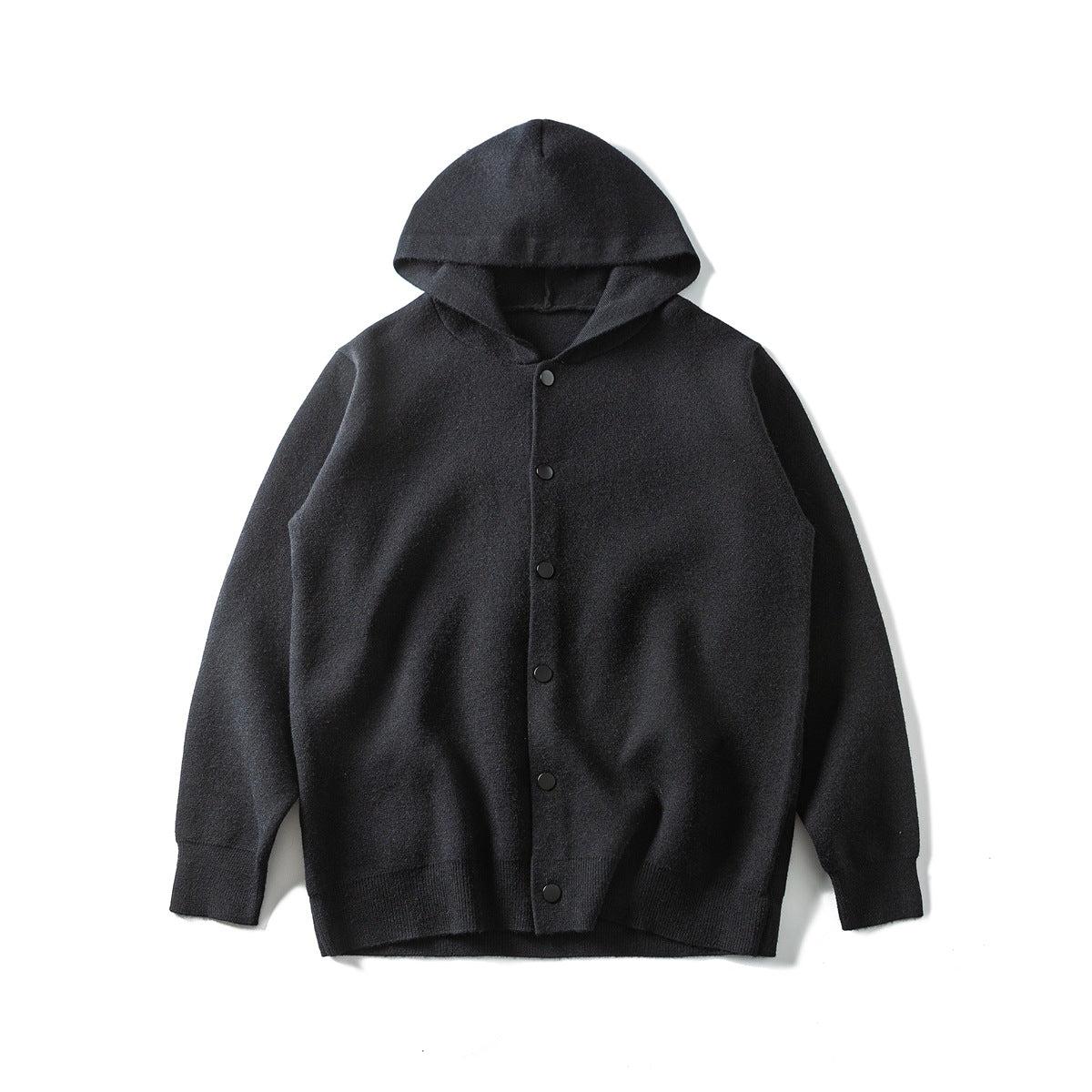 Black knit hooded cardigan flat lay with front snap-style buttons and ribbed cuffs and hem