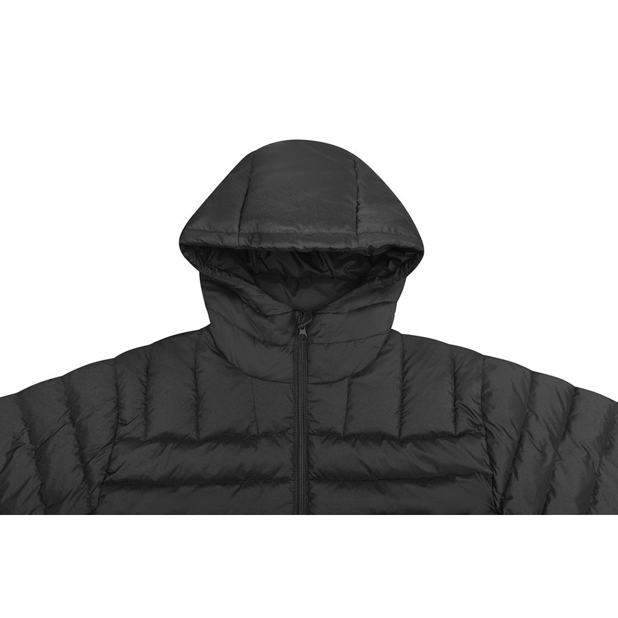 Close front view of a black quilted puffer jacket with a large hood and center zipper.