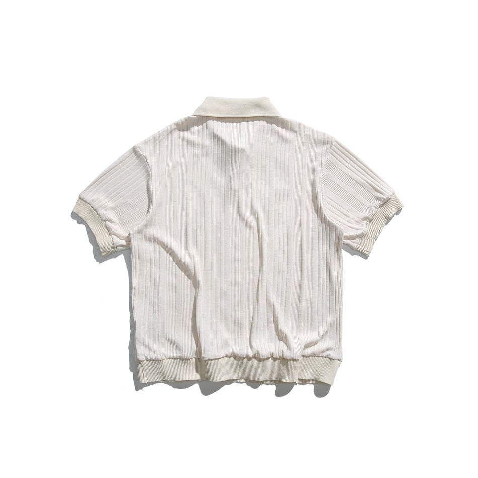 Back view of an ivory short-sleeve ribbed polo shirt with a collar and ribbed cuffs and hem.