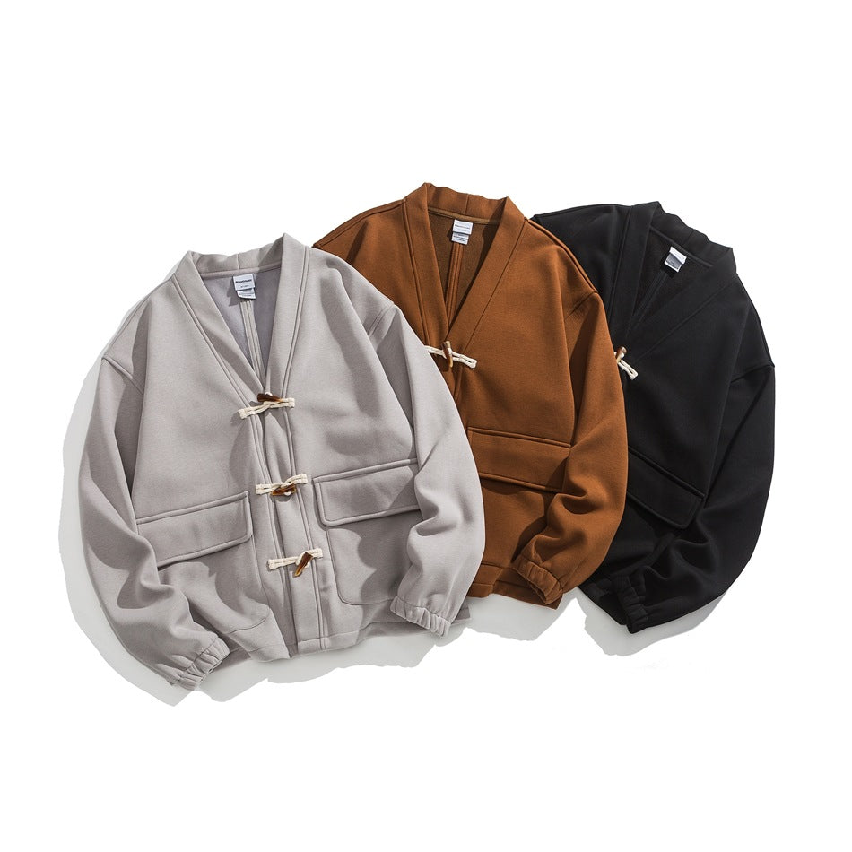 Three front-facing jackets in light gray, rust brown, and black with toggle closures and patch pockets.