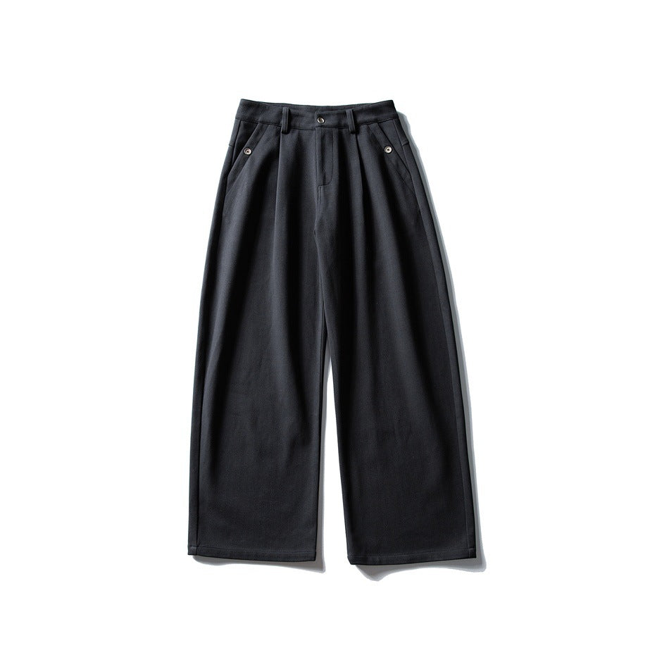 Black-gray wide-leg pleated trousers laid flat, front view, with belt loops, button closure and pocket details