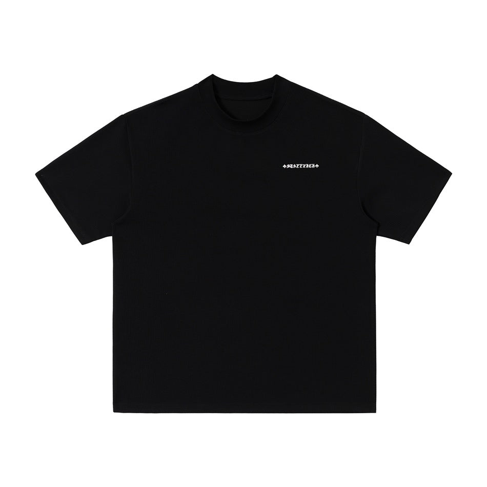 Front view of a black short-sleeve crew-neck T-shirt with a small light chest mark.