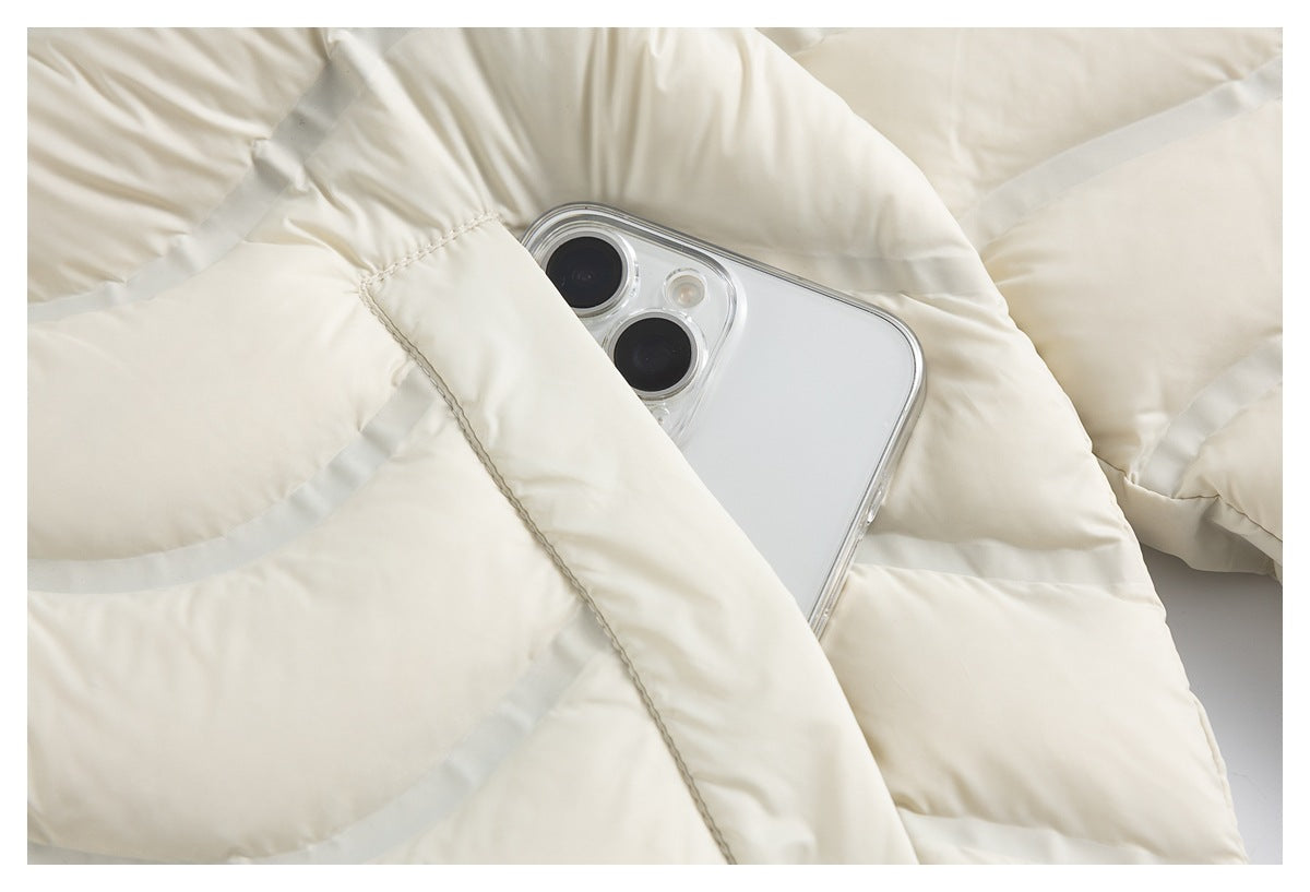 An ivory jacket pocket holds a smartphone, showing the pocket opening and quilted padding.