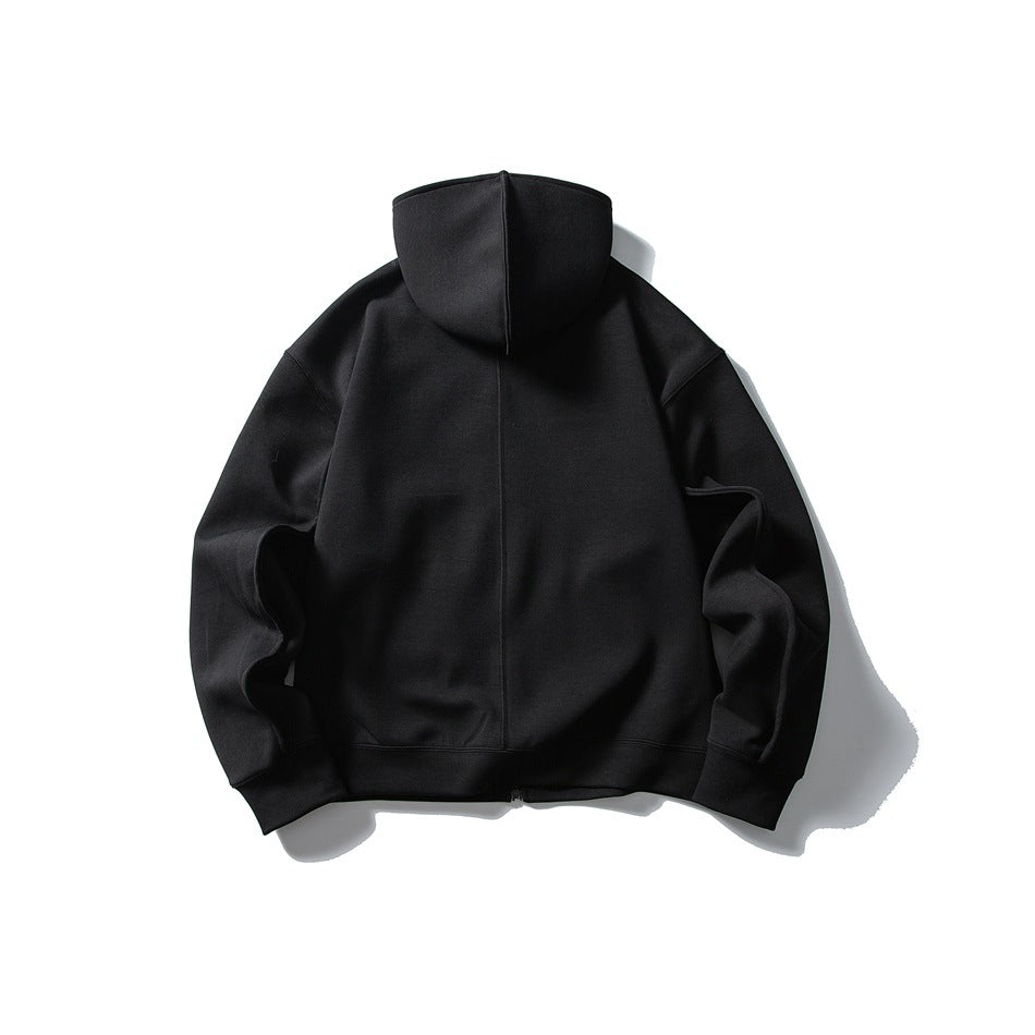Black zip-up hoodie laid flat, back view, with center back seam, hood and ribbed cuffs and hem