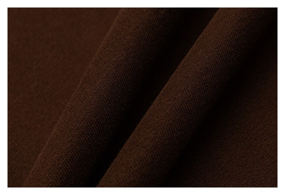 Close-up showing the texture and folds of dark brown fabric.