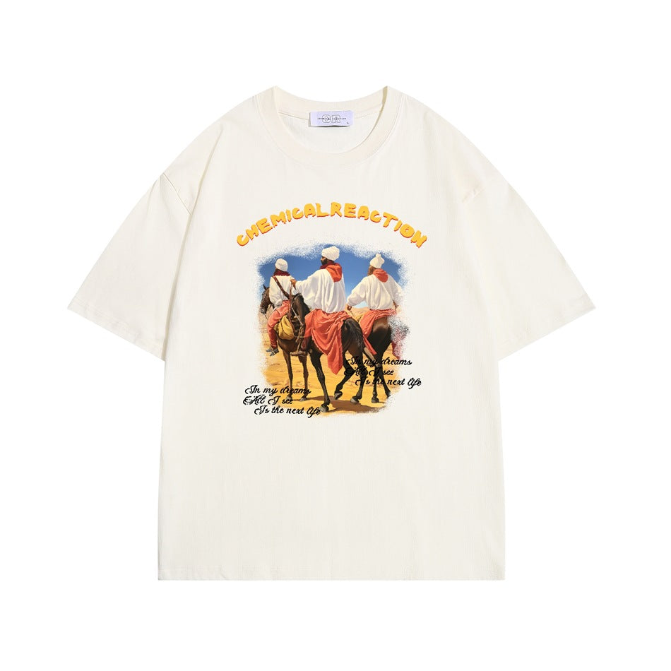 Cream apricot short-sleeve T-shirt with desert riders on horseback print and yellow CHEMICAL REACTION lettering
