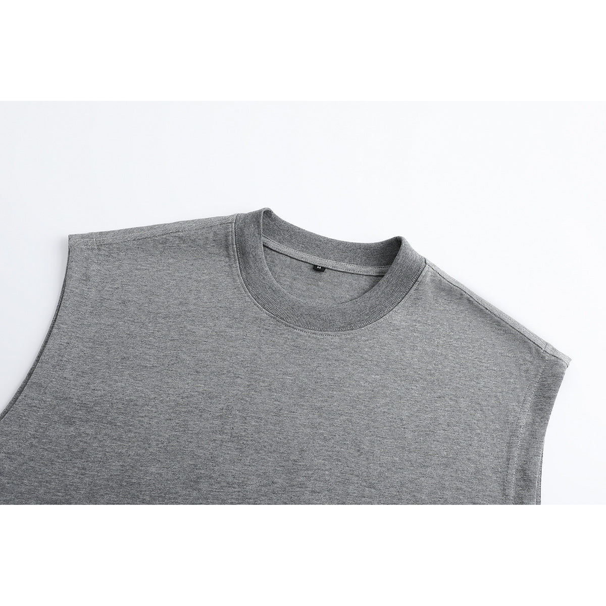 Close-up of the upper front of a heather gray sleeveless crew-neck top.