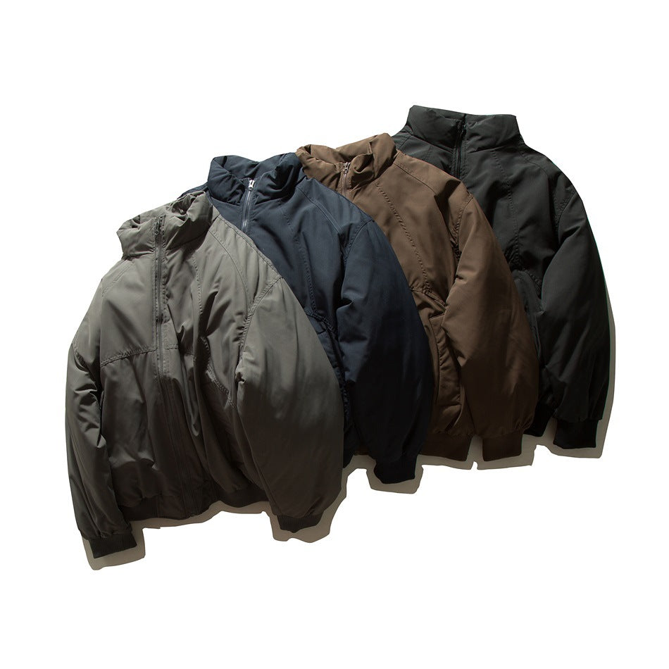 Four zip-up jackets with stand collars shown together in gray, navy, brown, and black.