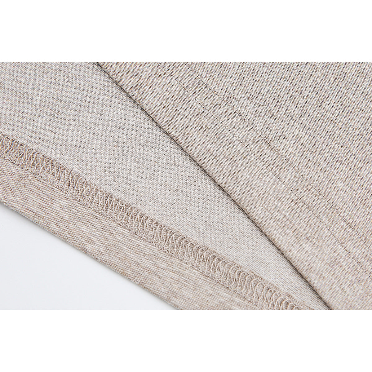 Close-up of the beige heather T-shirt's stitched hem and seams.