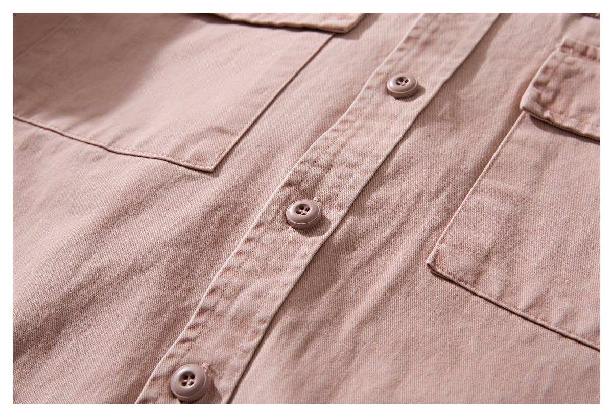 Close-up of the dusty rose shirt front with matching buttons, placket, and flap chest pockets.