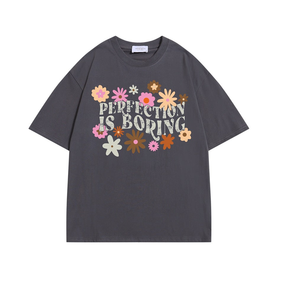 Gray short-sleeve crew neck T-shirt with colorful retro flowers and 'PERFECTION IS BORING' print