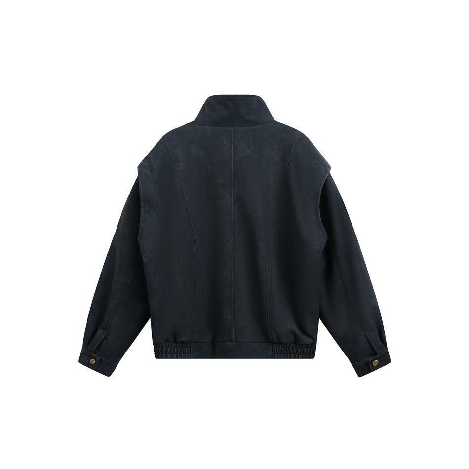 Back view of a black jacket with a raised collar, paneled seams, buttoned cuffs and a gathered hem.