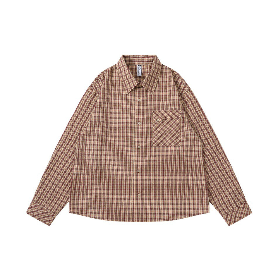 Red and tan plaid long-sleeve button-up shirt with chest pocket, flat lay front view