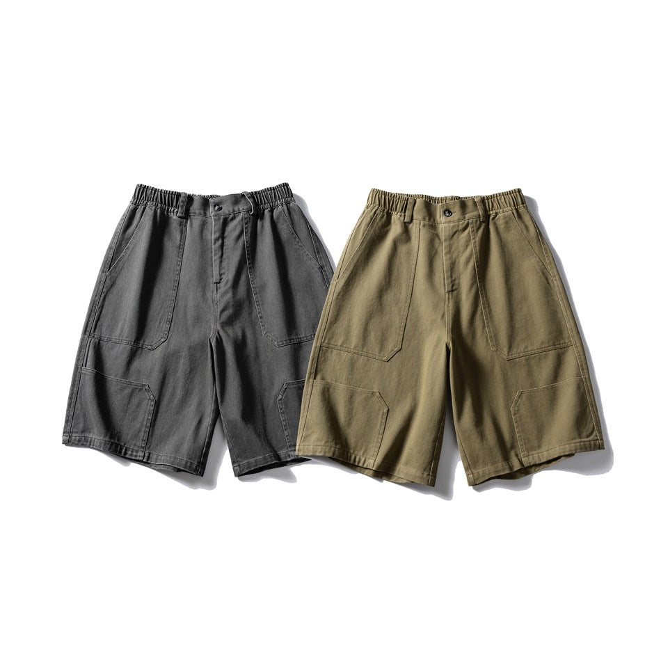 Front view of roomy cargo shorts in charcoal gray and olive khaki, shown side by side.
