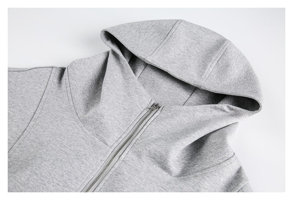 Close-up of a light gray hood and silver front zipper on a hooded sweatshirt.