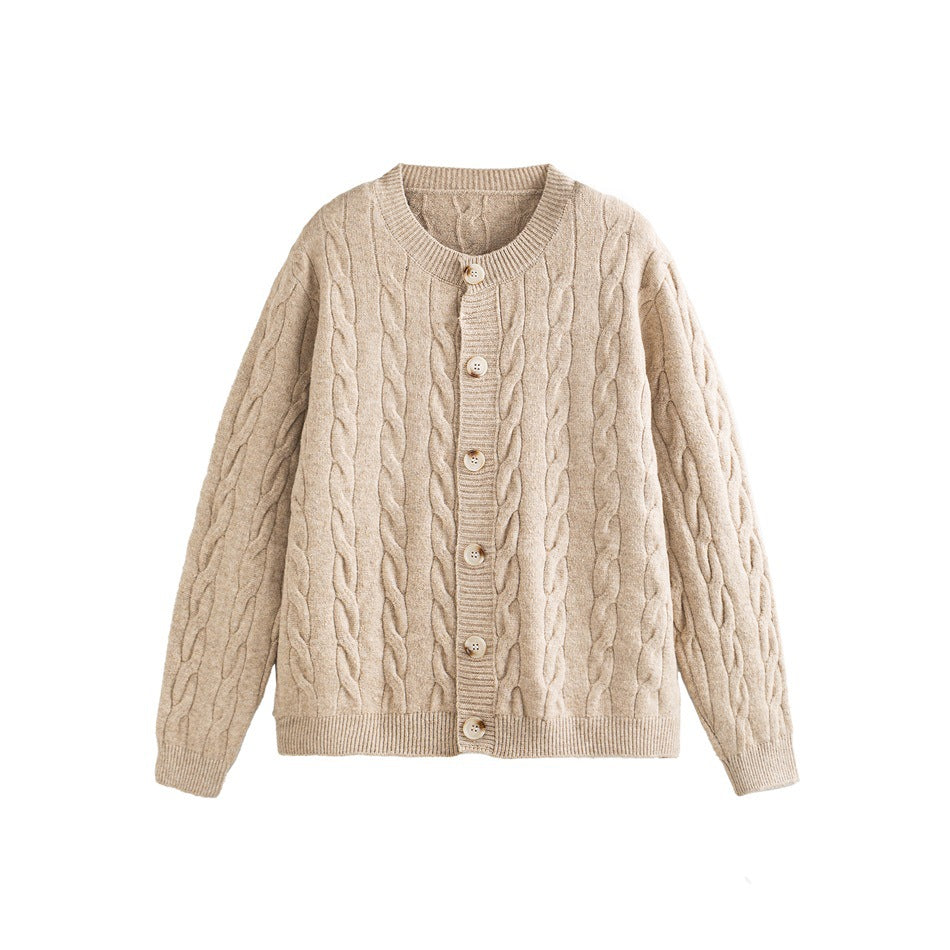 Apricot cable-knit button-front cardigan with round ribbed neckline, flat lay on white background