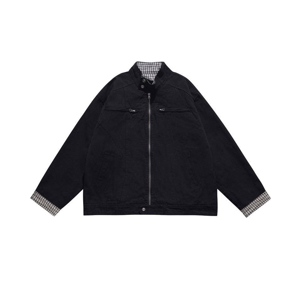 Black stand-collar zip jacket with chest zip pockets and check cuffs and inner collar, front flat view