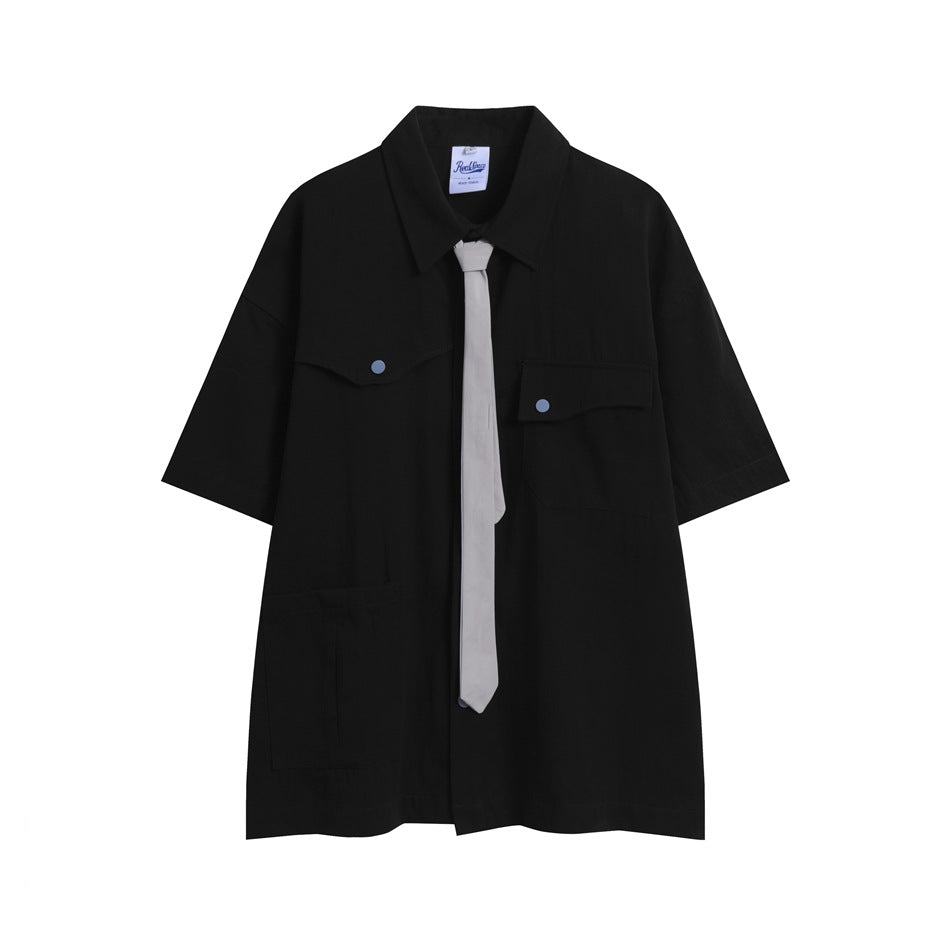 Black short-sleeve collared shirt with chest flap pockets, large lower pocket and gray necktie, flat front view