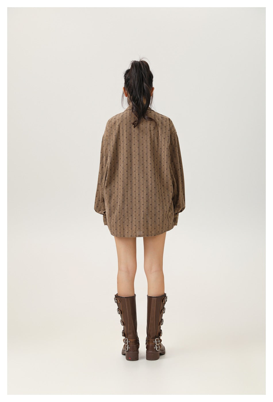 Model wearing the brown patterned button-up shirt, shown from behind.